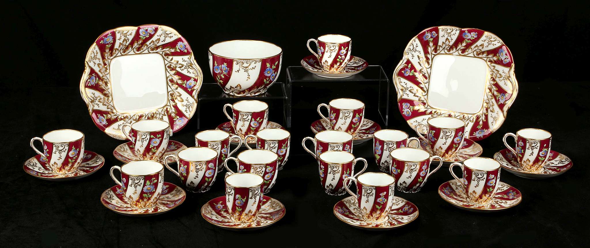 AN ENGLISH PORCELAIN TEA AND COFFEE SERVICE, mid 19th century, decorated with flowers on a crimson