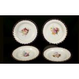 A SET OF FOUR DERBY PLATES, circa 1795, each finely painted with sprays of flowers, the fluted