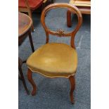 A harlequin set of seven Victorian walnut dining chairs and another dining chair, with stuff over