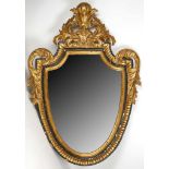 A 19th century, carved giltwood pane mirror, having foliate pediment scrolling leaves to sides,