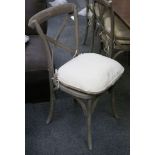 A set of six grey painted dining chairs with squab cushions on a splayed circular section legs.