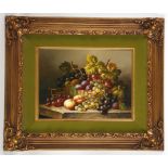 Oil on panel, a still life study of a basket of fruit in a basket on a stone wedge, in ornate gilt