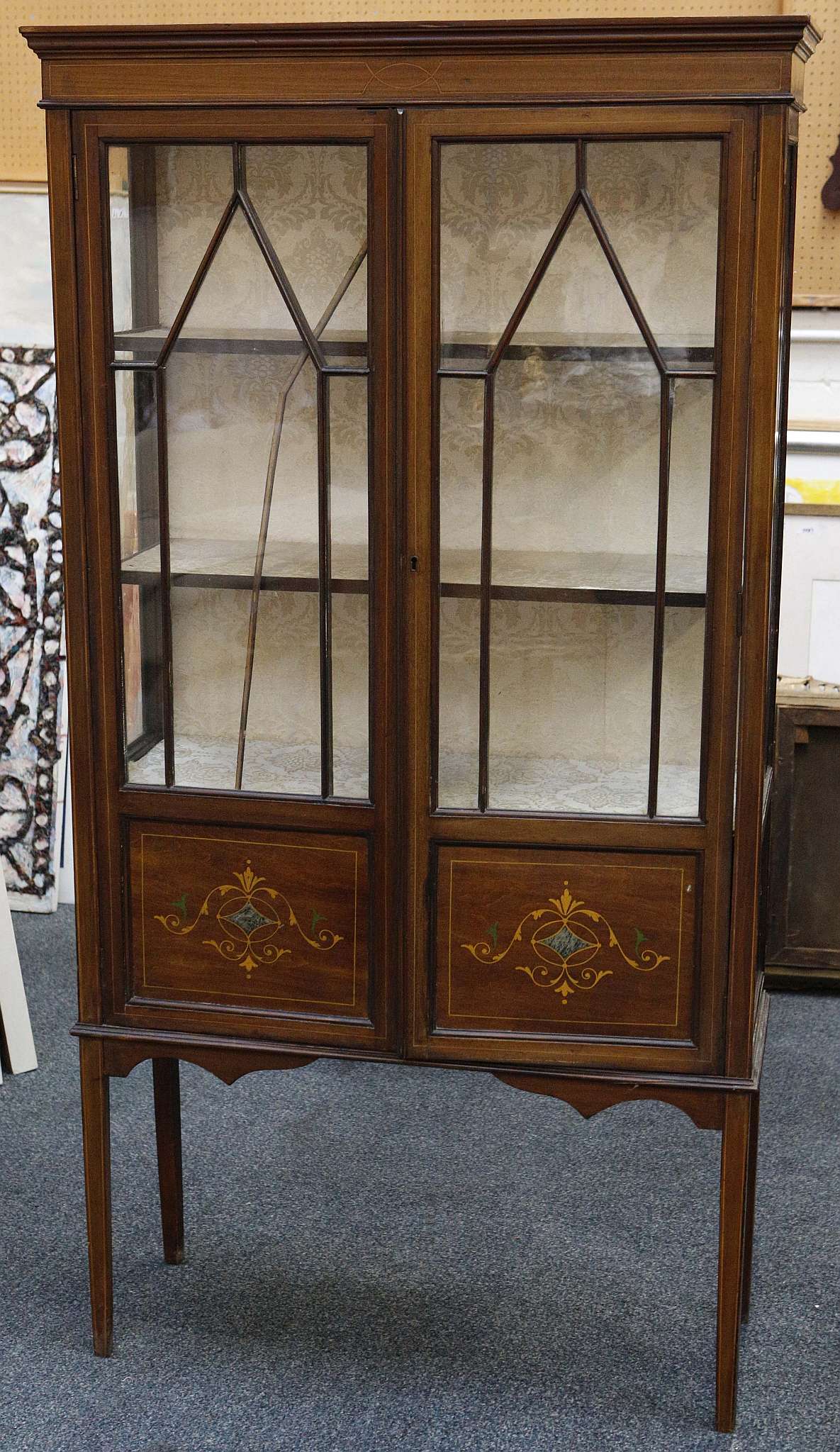 An Edwardian display cabinet, mahogany with satinwood inlay, astral glaze, double doors with