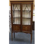 An Edwardian display cabinet, mahogany with satinwood inlay, astral glaze, double doors with