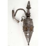 A white metal (possibly silver) hookah pipe with stiff leaf and wirework decoration.