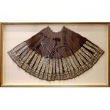 A large early 20th century, Romanian traditional skirt in purple wool with silvered floral