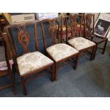 A 'Harlequin' set of four 19th century elm dining chairs with pierced scrolling splat backs,