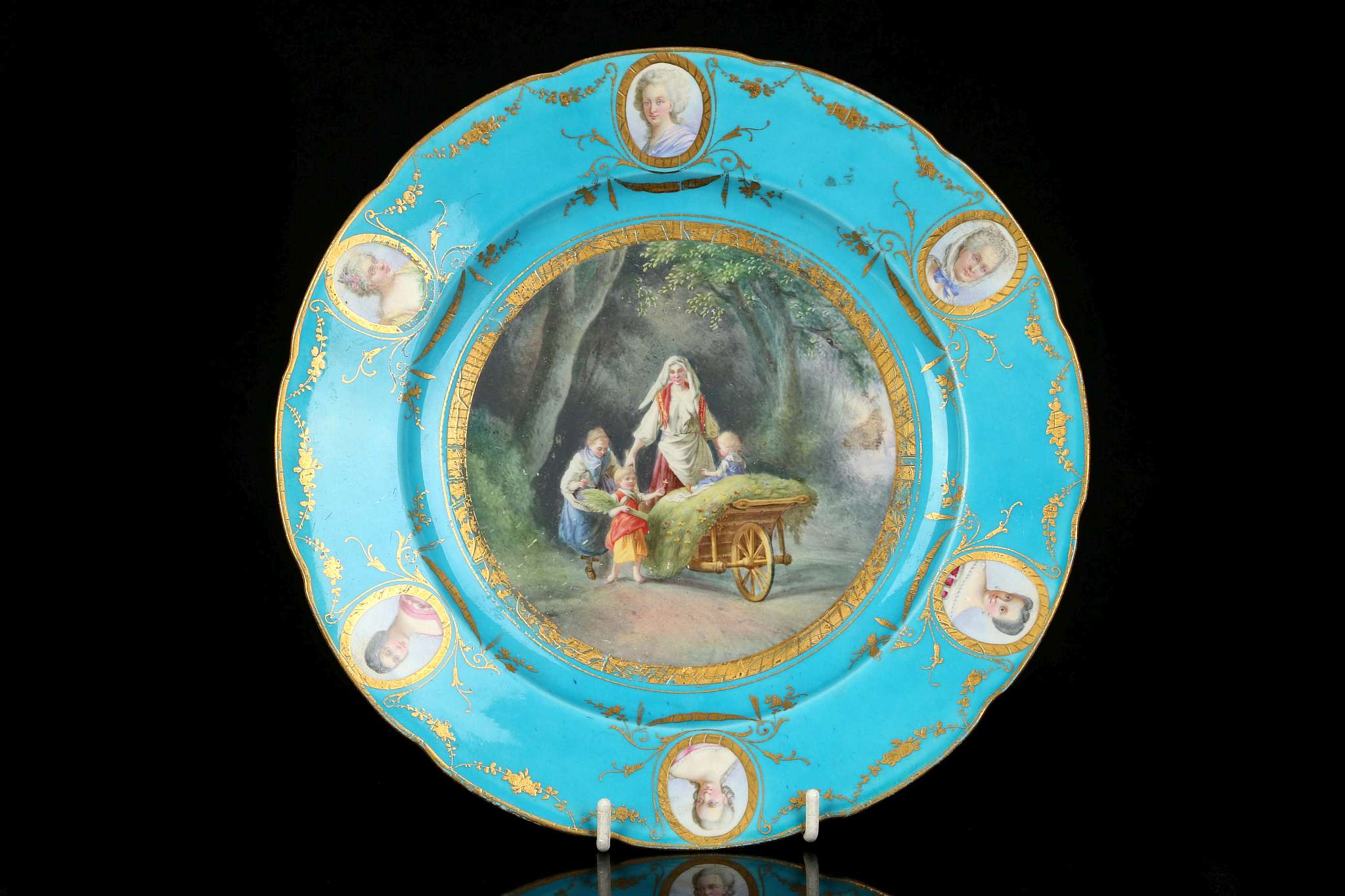 A SEVRES-STYLE CABINET PLATE, late 19th century, finely painted with a scene of a lady pushing a