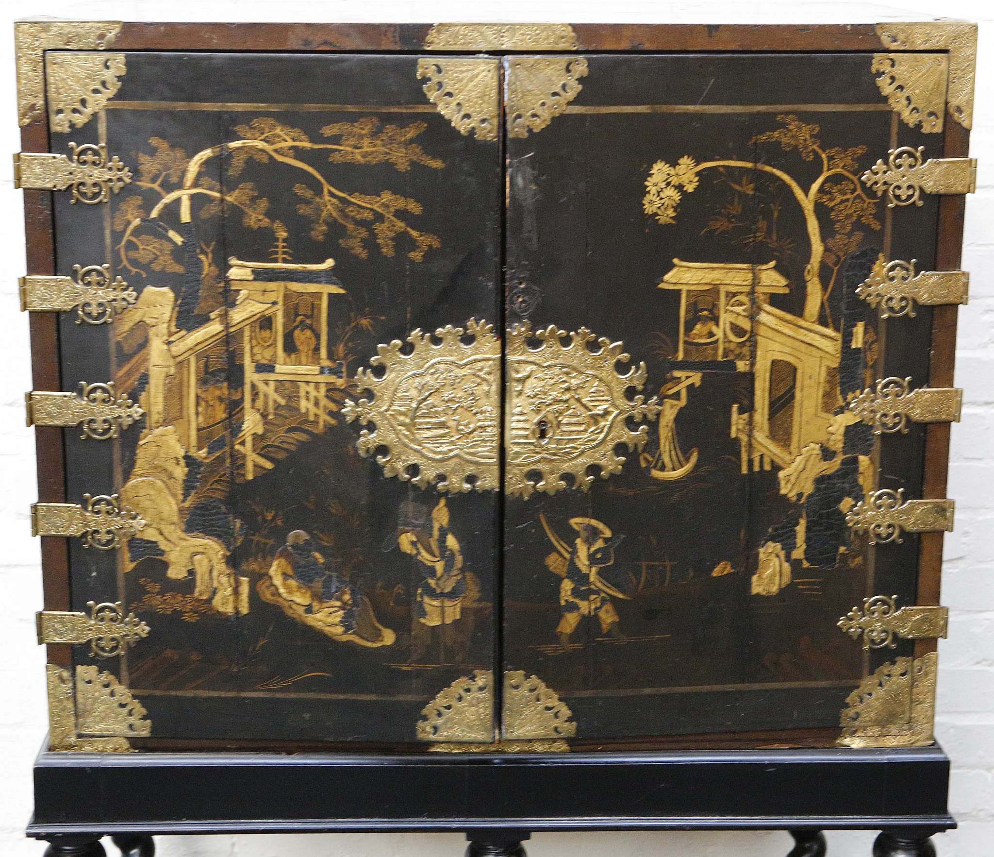An 18th century chinoiserie black and gold lacquered two doored cabinet, opens to reveal many - Image 2 of 3