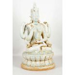 A celadon glaze study of a Hindu goddess, six arms holding, vases and plants, 40cm.