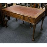 An Edwardian library table / bureau plat, walnut, claret leather insert with gilt tooling, 3