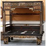 A Chinese four post canopy bed, Jiazichuang, with carved and pierced open-work panels to the top and