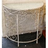 A demi-lune mirrored topped console table raised on scrolling cast iron supports. 90 x 45 x 85cm.