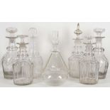 A collection of early 19th century, cut glass decanters and stoppers, including two pairs with