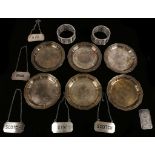 A set of six solid silver hexafoil pin dishes, c.1900. Germany. A one ounce silver bar. Silver