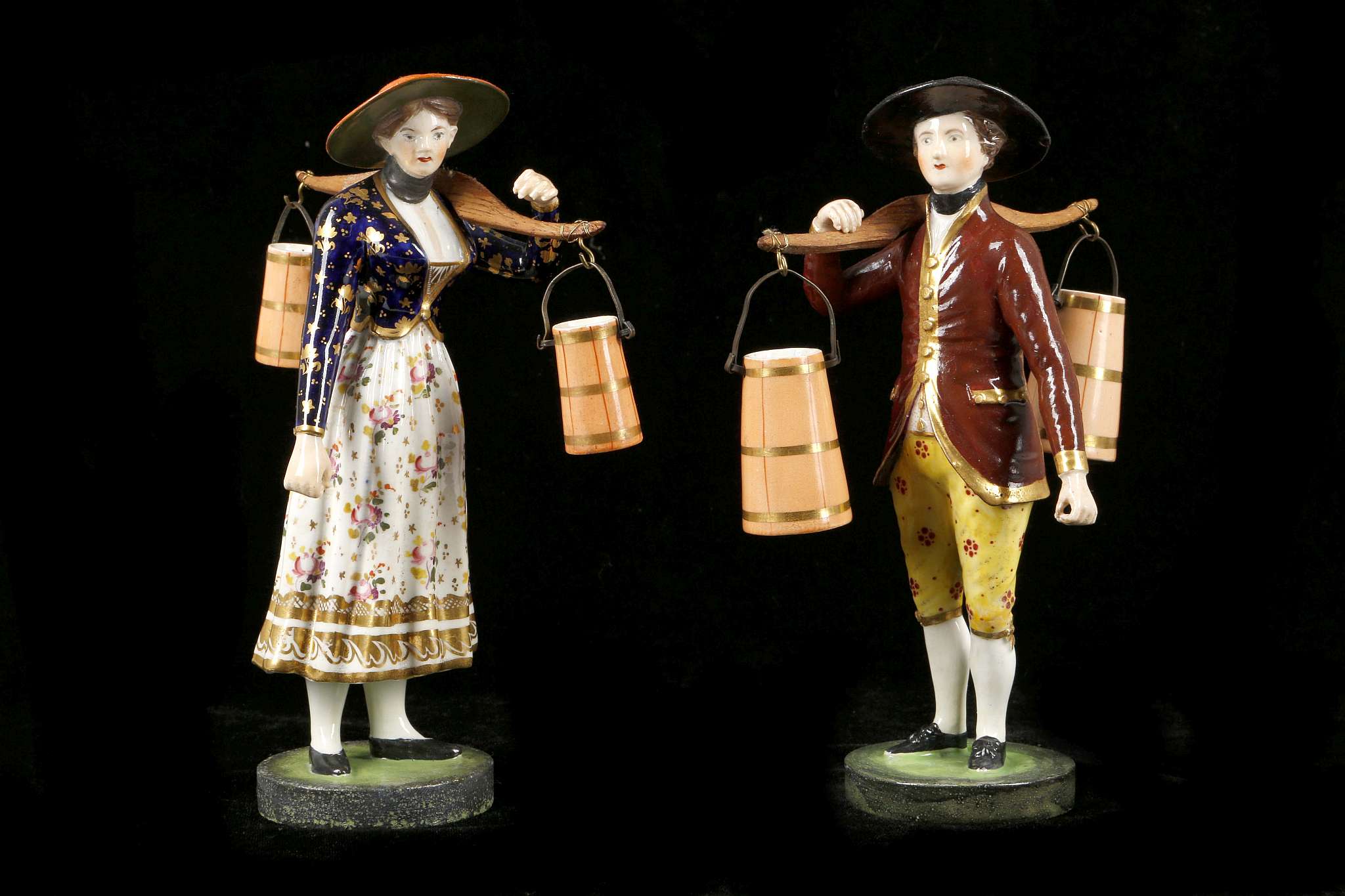 A PAIR OF DERBY FIGURES OF A MILKMAN AND MILKMAID, circa 1820, both modelled standing, carrying