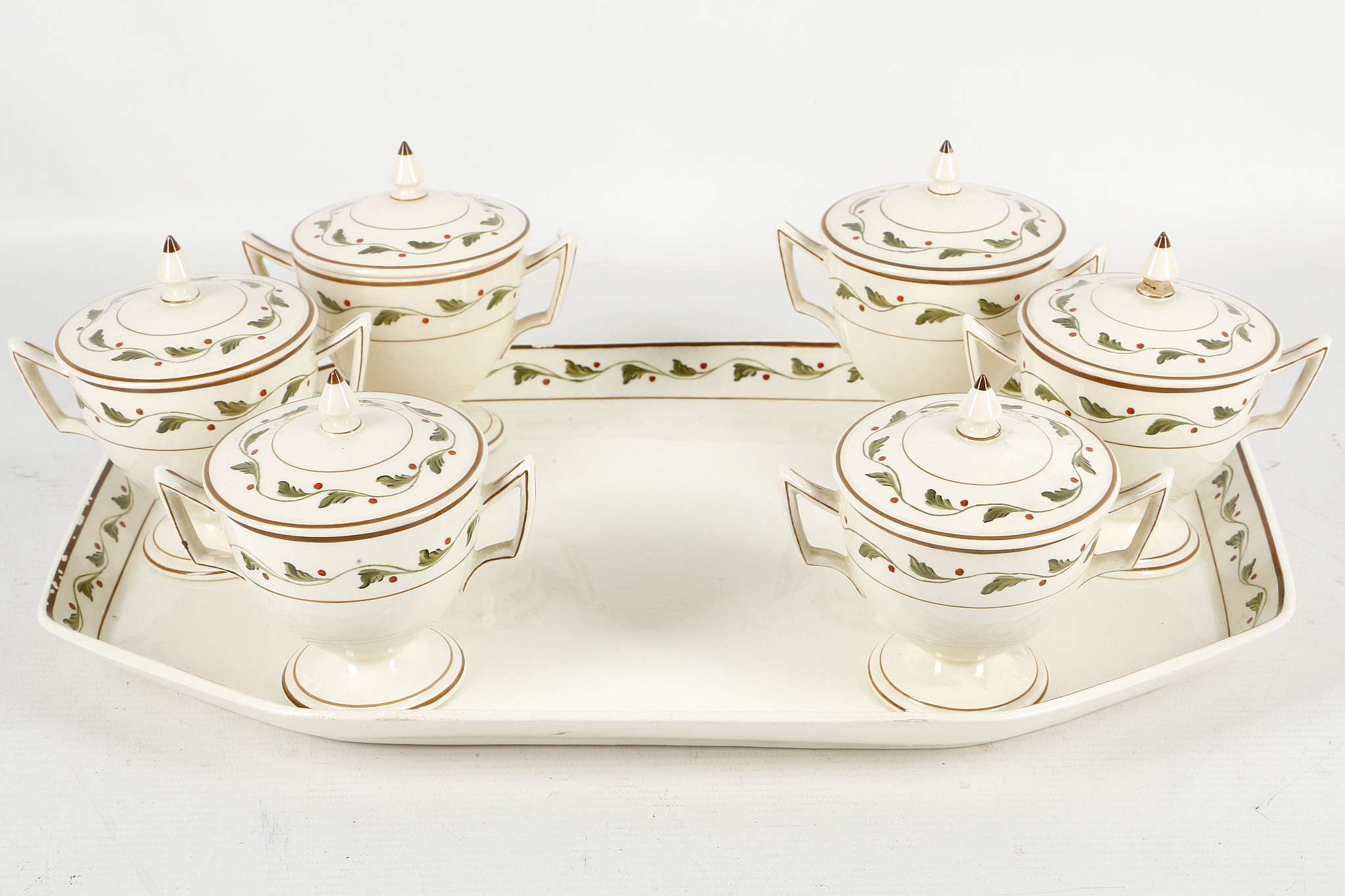 A Wedgwood creamware tray with 6 twin handled lidded cups and saucers, all with painted border