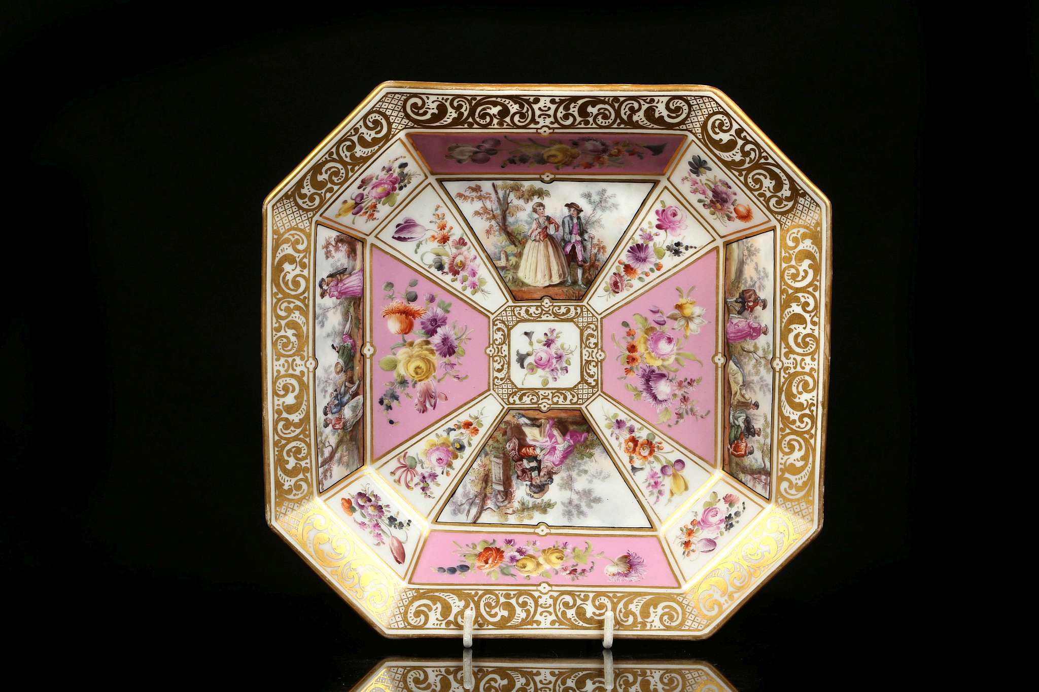 A FINE BERLIN DISH, early 19th century, of octagonal shape, finely painted with panels of courting