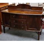 A 1930's bow front sideboard, mahogany, egg and dart bead to arch backboard, cupboards flanking 3