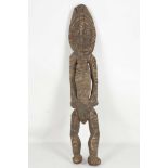 A BARK CARVING, MIDDLE SEPIK REGION, PAPUA NEW GUINEA
 Representing a male figure, decorated with
