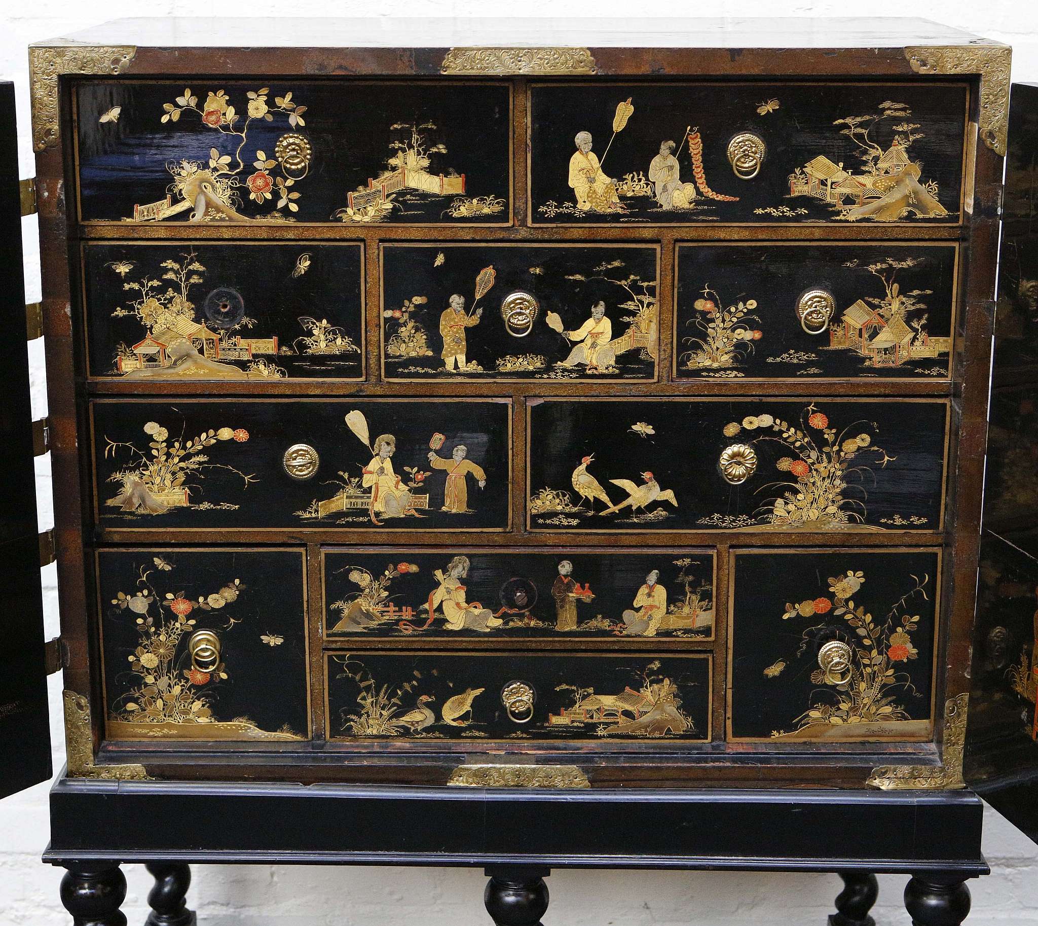 An 18th century chinoiserie black and gold lacquered two doored cabinet, opens to reveal many - Image 3 of 3