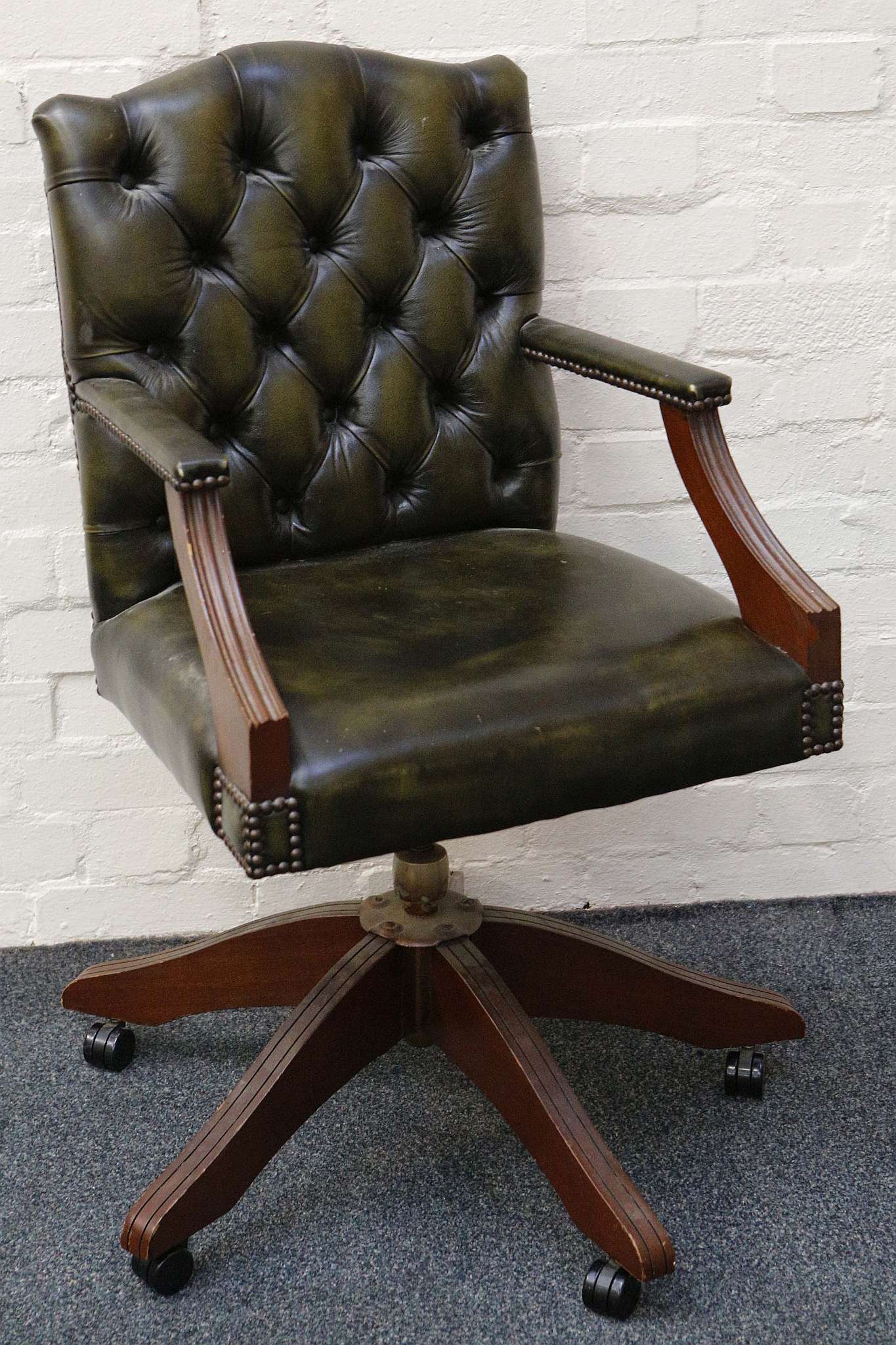 An office / study chair, green leatherette button back and elbows, 53cm wide x 53cm deep x 95cm high