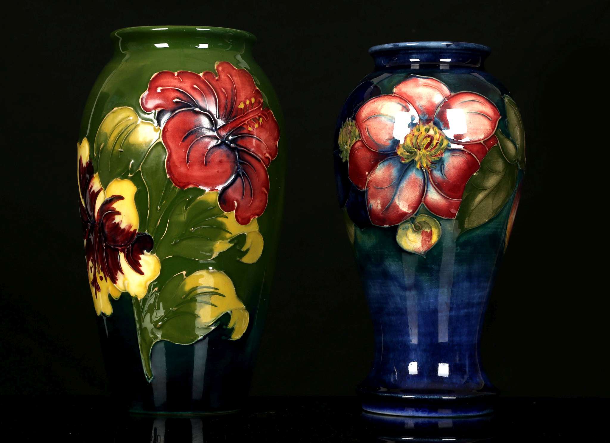 TWO WALTER MOORCROFT POTTERY VASES, mid 20th century, comprising an ovoid vase decorated in the '