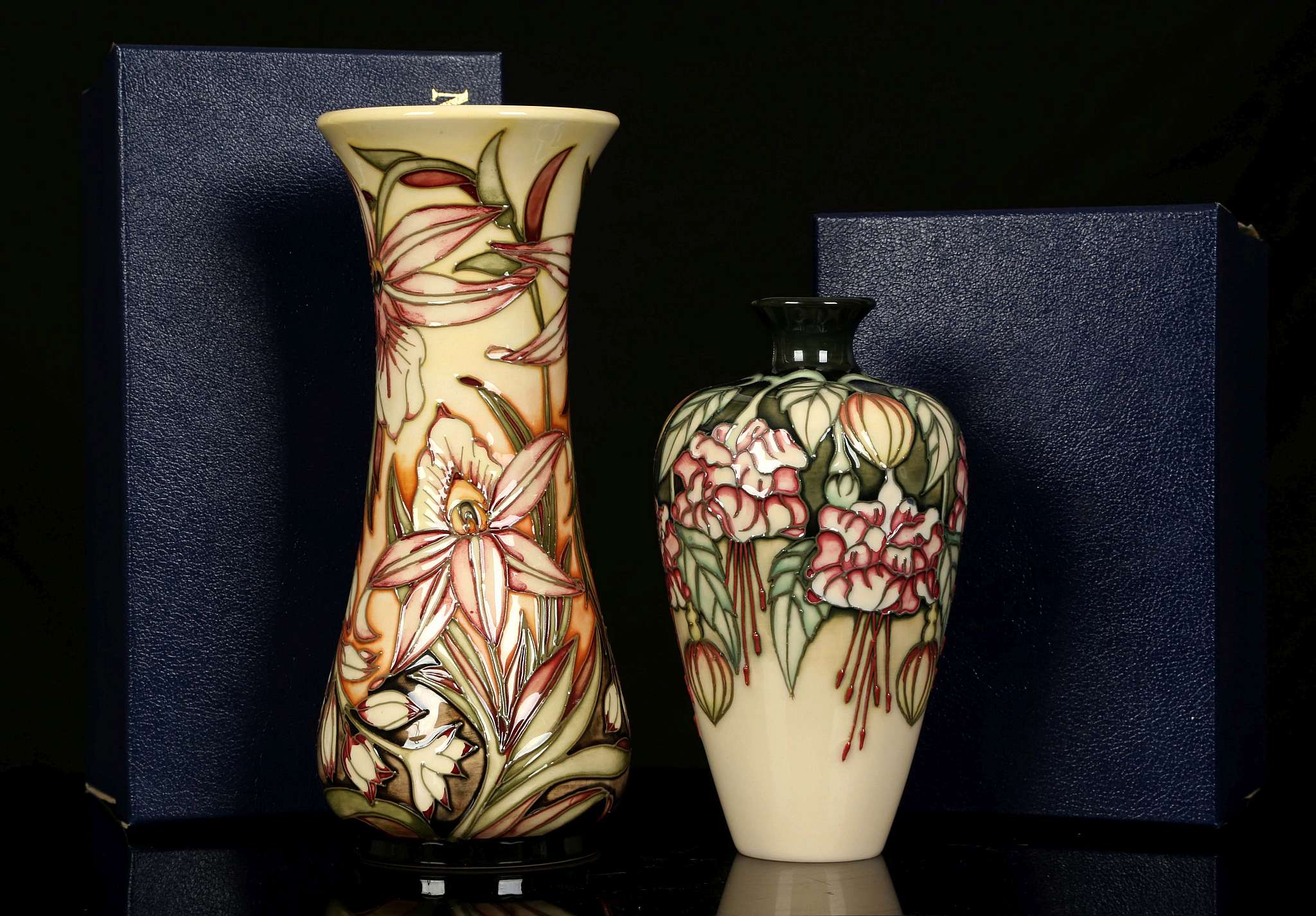 TWO LIMITED EDITION MOORCROFT POTTERY VASES, one decorated in the 'Sunderland' pattern by Shirley