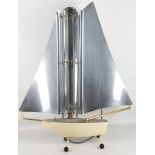 A 1950's heater in the form of a yacht, manufactured by Bunting McConnell, bears metal label. 77cm