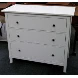 A modern cream painted chest of three long drawers, raised on square section legs. 96 x 108 x 50cm.