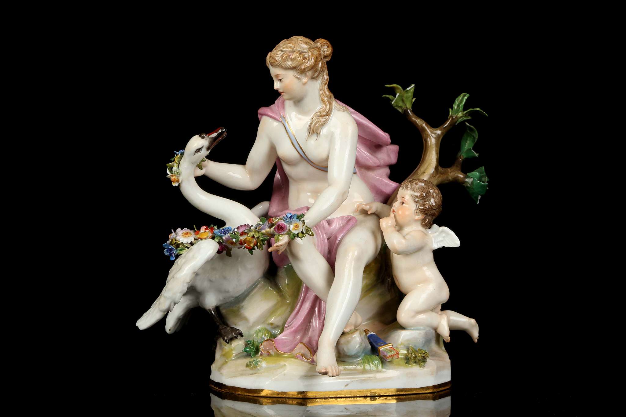 A MEISSEN FIGURE GROUP OF 'LEDA AND THE SWAN', mid 19th century, modelled seated, placing a