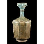 A KASHAN POTTERY TURQUOISE-GLAZED BOTTLE OR SPRINKLER, 12th or 13th century, Persia, of