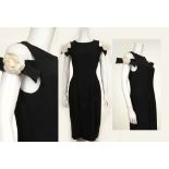 CHANEL BOUTIQUE COCKTAIL DRESS, black silk of shift form with low front pockets, satin ribbon off-