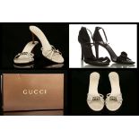 GUCCI HEELED SANDALS, cream leather with pale gold tone metal logo at toes, with dust bag and box,