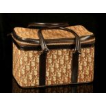 VINTAGE DIOR COSMETIC CASE, 1970s, brown monogrammed fabric with leather trim, 32cm x 20cm x 18cm,