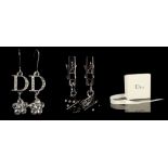 TWO PAIRS OF DIOR EARRINGS, one clip-on pair with hanging die detail, the others with diamanté 'D'