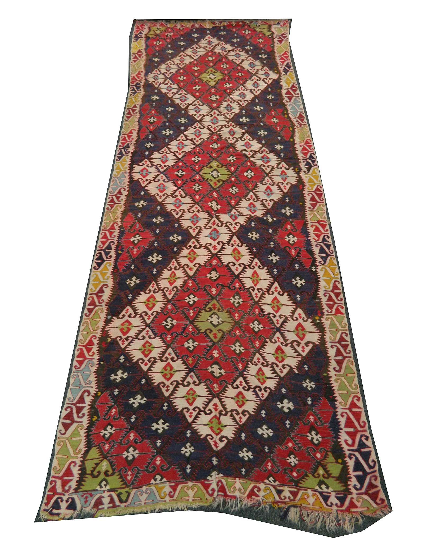 An early to mid 20th Century Anatolian kilim, 4.54m x 1.58m. Condition rating C.