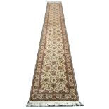 Pakistan ivory ground runner, 6.77m x 0.94m. Condition rating A.