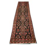 Persian Hamadan runner, 4.33m x 1.06m. Condition rating A.