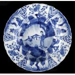A CHINESE BLUE AND WHITE DISH.

Qing Dynasty, Kangxi era.

The rounded sides rising to an everted