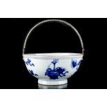 A CHINESE BLUE AND WHITE BOWL MOUNTED WITH AN ENGLISH SILVER HANDLE.
Qing Dynasty, the bowl Kangxi