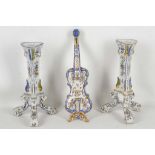 A pair of French Desvres faïence candlesticks and