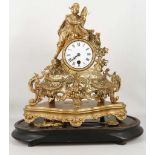 A Victorian gilt spelter figural mantle clock under glass dome, drawn movement, surmounted by