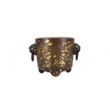 A CHINESE GOLD SPLASHED BRONZE TRIPOD CENSER.Qing