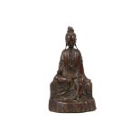 A CARVED WOODEN FIGURE OF GUANYIN.
Qing Dynasty, 1