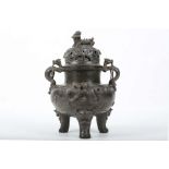 A CHINESE BRONZE CENSER AND COVER.
Ming Dynasty, or later.
The globular body decorated in relief