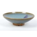 A JUN STYLE BOWL.
Late Qing Dynasty, 19th Century.
Covered with a thick glaze of milky-blue tone