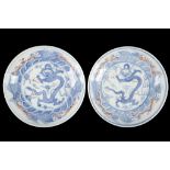 A PAIR OF BLUE AND WHITE DRAGON PLATES.
Late Qing, 19th Century.
The interior with a central roundel