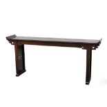 A CHINESE HARDWOOD RECESSED-LEG LONG TABLE, QIAOTOUAN.
Late Qing Dynasty.
The narrow single plank
