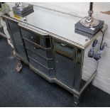 An Art Deco style mirrored sideboard with four drawers, flanked by two cupboards. 100 x 40 x 80cm.